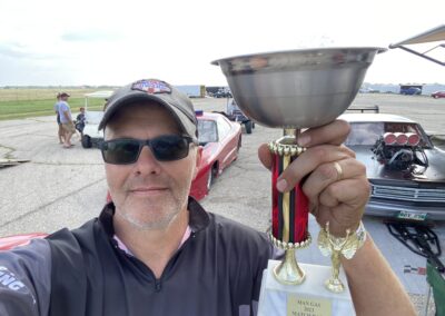 A man holding the 2023 year award